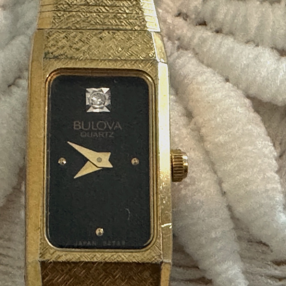 Vintage Bulova gold band with black with diamond watch